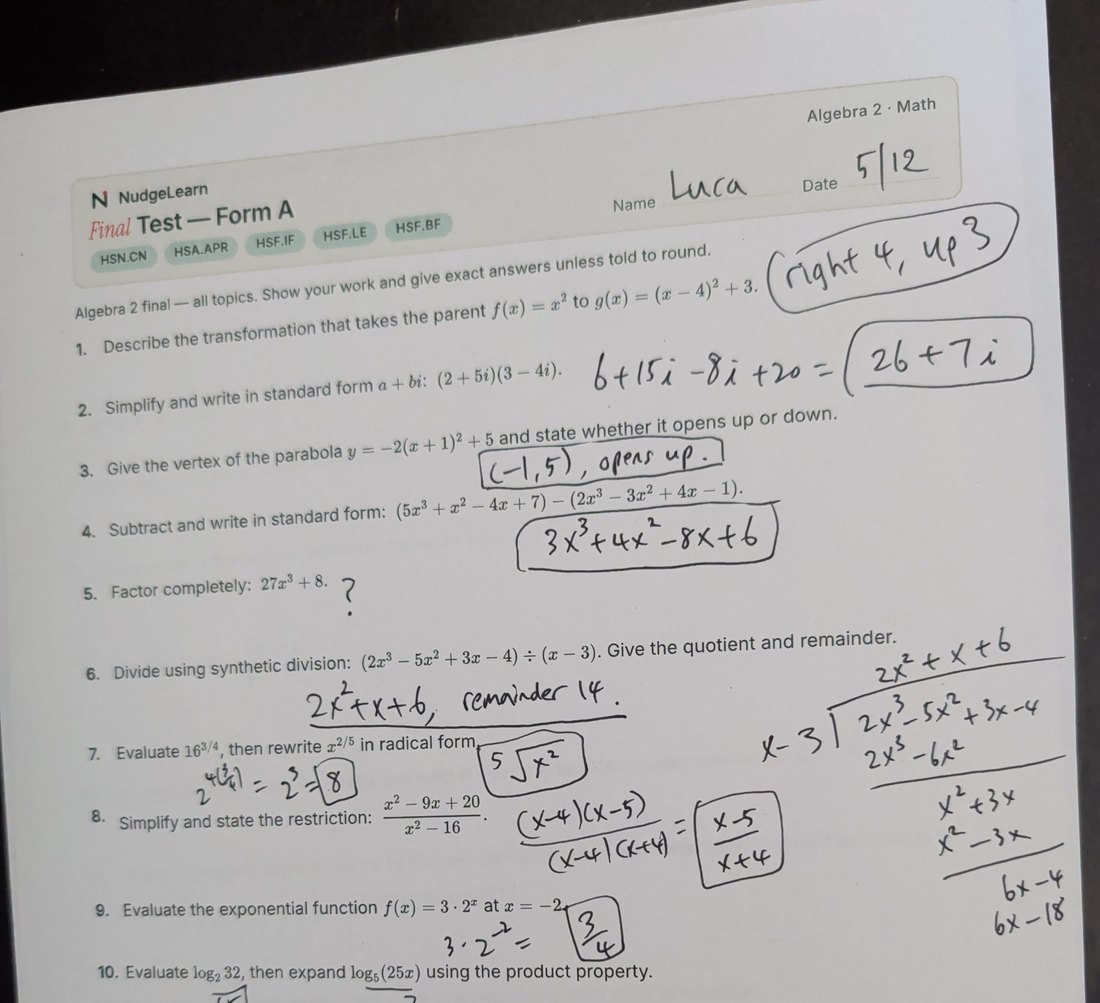 A finished Algebra 2 worksheet on the desk